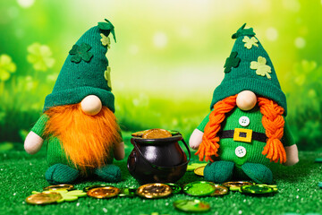 Male and Female stuffed St. Patrick's next to a cauldron