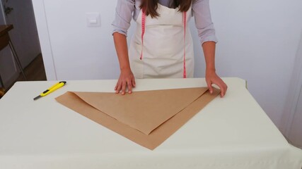 Florist arranging kraft paper for a bouquet