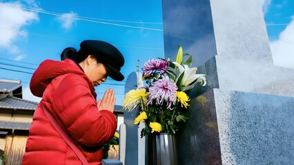Worshiping devoutly at a woman’s grave