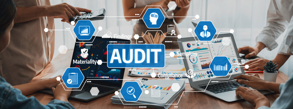 A diverse business team engaged in a financial audit, utilizing technology on laptops. Visuals highlight collaboration and analysis in a modern office setting. Amity - Powered by Adobe