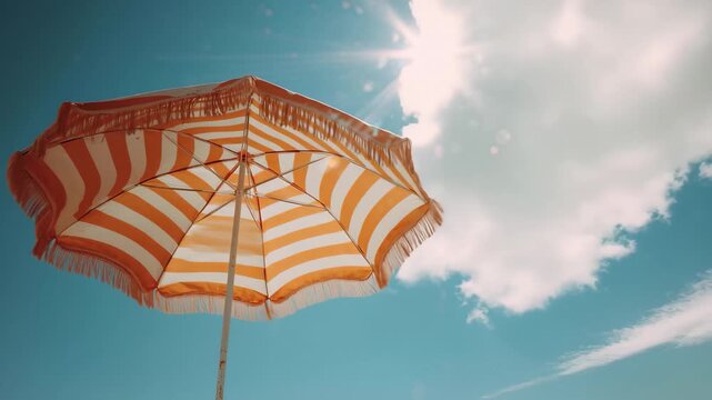 Vintage Beach Umbrella Against a Clear Blue Sky with Sun Flare and Intense Summer Heat