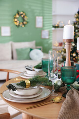 Festive table setting with Christmas decor indoors, closeup
