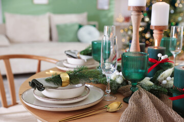 Festive table setting with Christmas decor indoors, closeup
