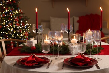 Festive table setting with Christmas decor indoors, closeup