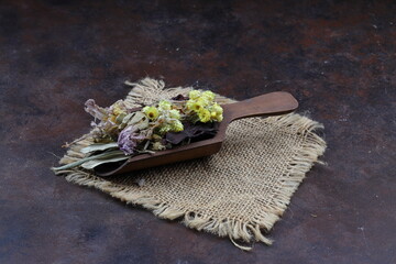 Winter tea for health in cold weather. Flavored with ginger, cinnamon, hibiscus, and orange. Isolated on woodenn background