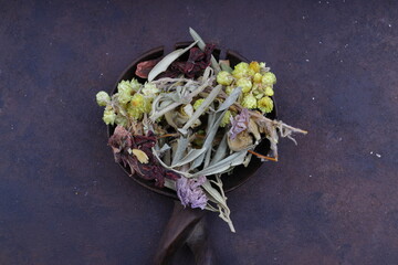 Winter tea for health in cold weather. Flavored with ginger, cinnamon, hibiscus, and orange. Isolated on woodenn background