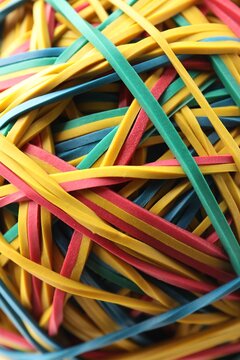 Many colorful rubber bands as background, closeup