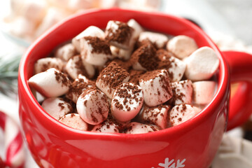 Tasty cocoa with marshmallows on table, closeup. Christmas atmosphere
