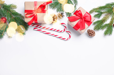 Wrapped Christmas gifts and decor on white background, flat lay. Space for text