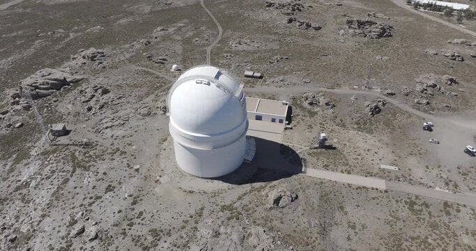 Aerial drone shot of Calar Alto Observatory telescopes in the Sierra de Los Filabres mountain range in Almeria, Andalusia, Spain. Largest astronomical observatory in Europe. Birds eye view