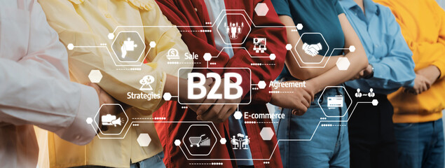 This image showcases a diverse group of business professionals standing together, emphasizing B2B strategies focused on e-commerce, collaboration, and digital innovation. Amity