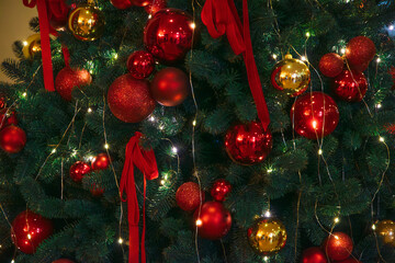 Christmas tree background with red and gold baubles decorations