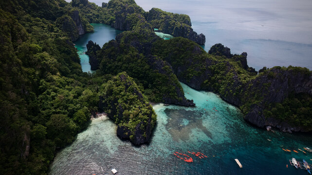 Beautiful Big Lagoon with kayaks surrounded by crystal clear blue water in Palawan, Philippines, South East Asia