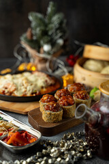 A delightful array of festive dishes fills the table, showcasing colorful appetizers and a hearty main course, all illuminated by warm light that creates a welcoming atmosphere