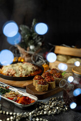 A vibrant spread of appetizing dishes fills the table, featuring savory meals and elegant garnishes, creating a warm atmosphere for a winter celebration