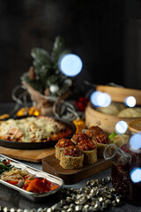 A vibrant table showcases a selection of tasty dishes perfect for a festive celebration. From succulent servings of pasta to charming appetizers, it creates a joyful atmosphere