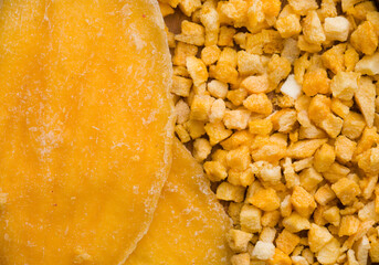background of dried mango pieces and slices