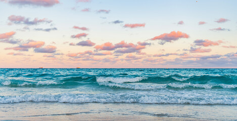 Calm horizon view at sea sunrise. Romantic summer vacation sunrise on seascape. Sea horizon view. Cloudy sky and seascape at summer vacation. Skyscape with sea horizon. Sunset on the horizon