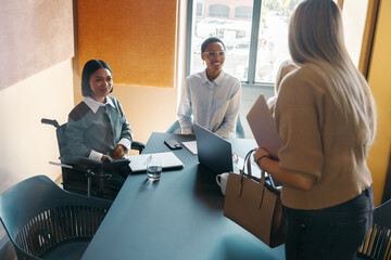 Diverse professionals discussing ideas during a team meeting in a modern workspace
