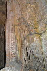 Massive Limestone Columns in a Deep Cave