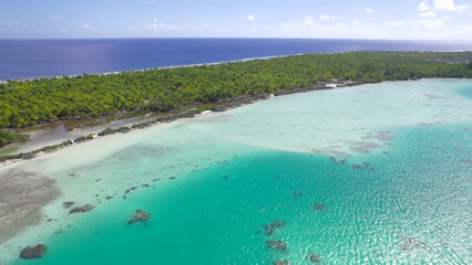 Luxury resort photo of French Polynesia tropical 
paradise islands Fakarava with coral reef. 
Aerial perspective photography with azure ocean, 
sky with clouds on horizon. Pacific Ocean.