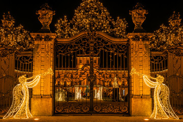 Eszterh&aacute;zy Palace gate with Christmas lights and angel decorations
