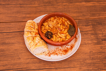 A perfectly cooked tripe dish, where the tripe is tender and the flavors of paprika, garlic, and bay leaf are perfectly infused into the sauce and chickpeas