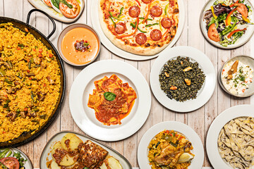 Meat paella with pork ribs, chorizo, and butifarra sausage, a hearty dish typical of inland areas...