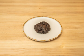Almond and cherry cookie with toasted flaked almonds and dried cherries, presented in a cellophane-wrapped gift box