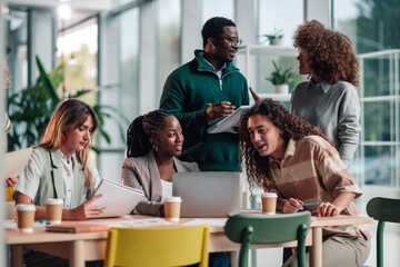 Diverse business team collaborating during office meeting