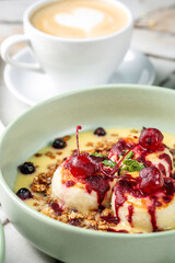 Sweet cottage cheese pancakes with berry sauce