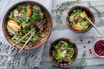 Wooden bowls of homemade Brussels Sprouts salad, ready for eating.