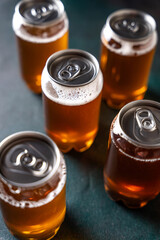 Cold craft drink cans with foam top view