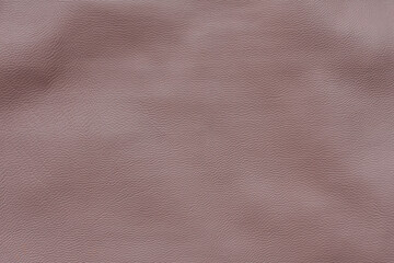 Fototapeta premium Light pink leather texture background. Powdery, pastel surface. Copy space, top view.