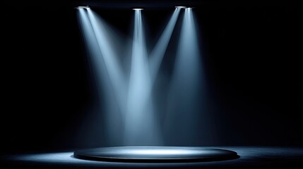 Three bright spotlights illuminate a circular stage on a dark background.