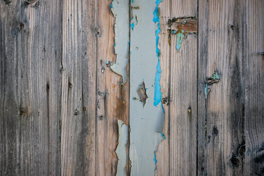 Rustic old wooden wall with peeling paint background