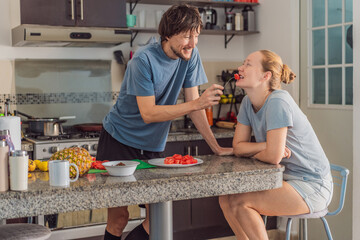 Woman and man preparing breakfast together in a bright kitchen, enjoying a warm morning routine. Home lifestyle, teamwork and cozy everyday living concept, reflecting connection, cooperation and a