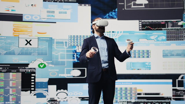 Modern businessman employs virtual reality headset in a digital environment focused on performance metrics, strategic planning through technology and analytics. Firm forecasting. Camera B. - Powered by Adobe