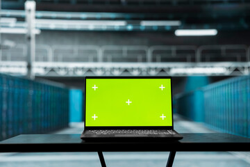 Close up of isolated screen laptop in high tech data center used to troubleshoot backend operations. Chroma key notebook in server farm running software development tools, resolving system crashes
