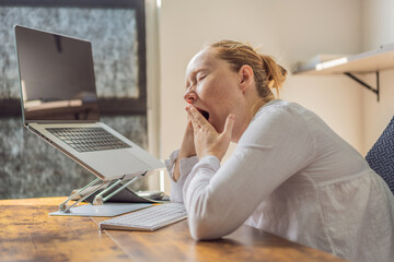 Woman working in her home office, focused on her laptop and daily tasks, creating a calm and productive workspace. Remote work, professional lifestyle and modern productivity concept representing