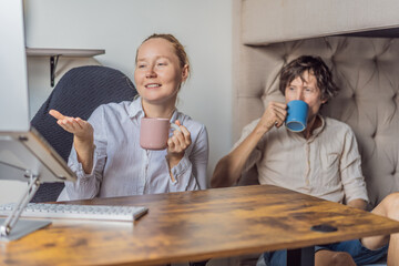 Man and woman working together in their home office, discussing tasks and collaborating on a project. Modern remote work, teamwork and productivity concept, representing communication, focus and