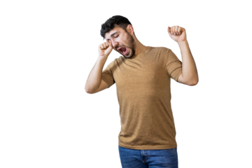 Sleepy young man yawning and stretching on white background. PNG