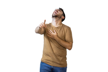 Young man laughing and pointing finger upwards on white background. PNG