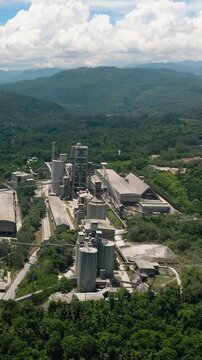 Seafront with Cement factory in Lugait, Misamis Oriental. Mindanao, Philippines. Vertical video.