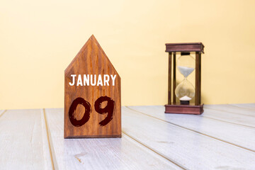 Wooden calendar block displaying the date January 09.