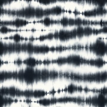 Abstract tie dye pattern graphic. Streaky horizontal design of indigo and white colours. Trendy textile print for apparel design. Fabric texture background suitable for fashion clothing.
