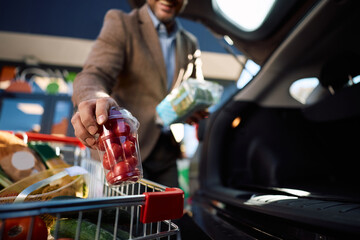 Close up of man shopping groceries in supermarket.