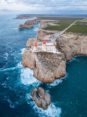Cape Sao Vicente, Lighthouse, Cliffs and Atlantic Ocean in Evening. Aerial View. Algarve, Portugal