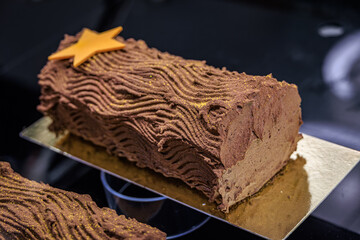 Rich Buche de Noel Christmas cake on display at a bakery in Zurich, Switzerland