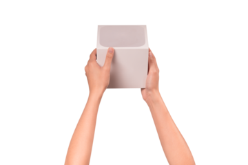 Close-up of hand holding a closed new white package box isolated on a transparent PNG. High quality studio shoot. concept for business, shopping, transportation, technology and advertising.